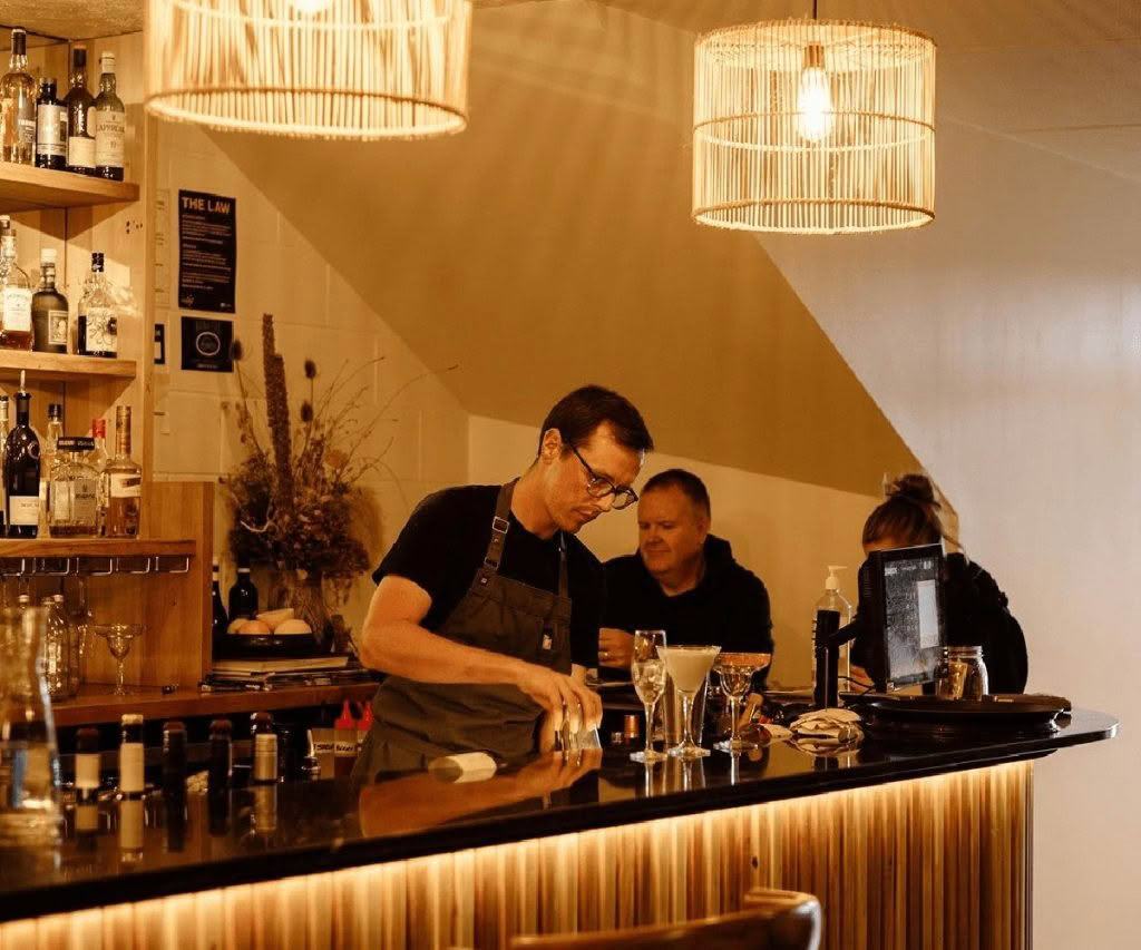 Cuisine-Good-Food-Guide-2024-Arc-Restaurant-Wanaka-Jake-making-cocktail-at-bar